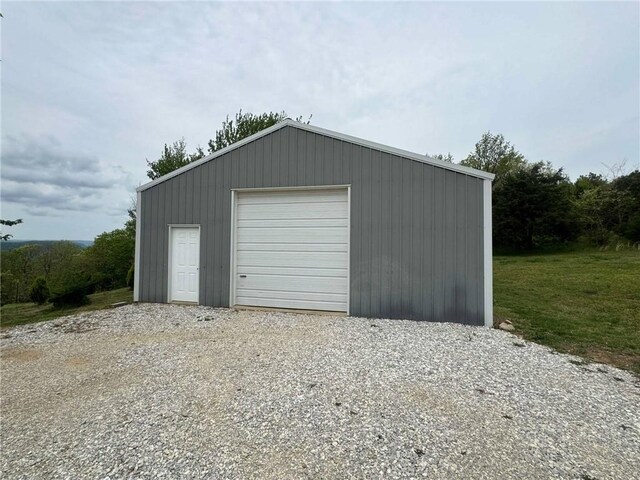 detached garage featuring driveway