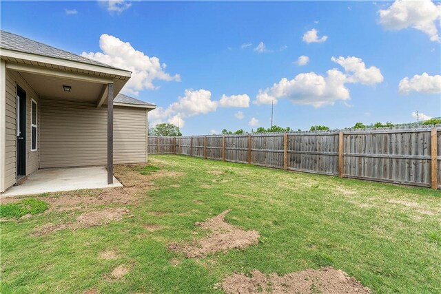 view of yard featuring a fenced backyard and a patio