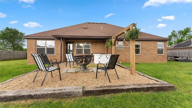 505 Blair Cir, Pea Ridge, AR 72751 - back of house with a lawn, a patio area, brick siding, a fenced backyard, and a shingled roof