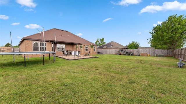 505 Blair Cir, Pea Ridge, AR 72751 - view of yard with a fenced backyard, a trampoline, and a patio area