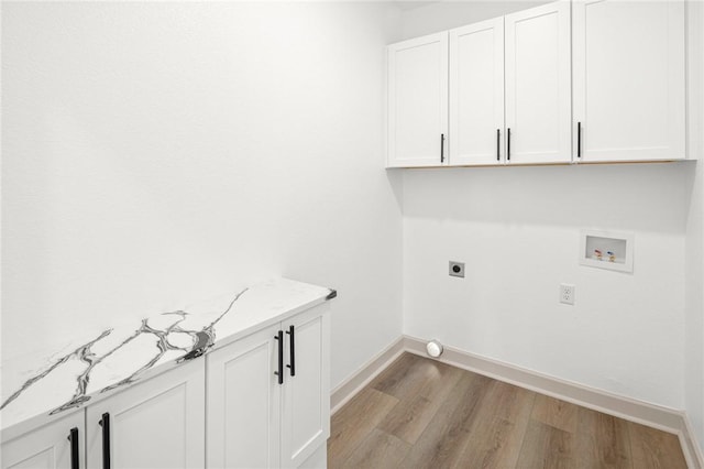 220 N C St, Rogers, AR 72756 - washroom featuring light wood-style floors, hookup for a washing machine, cabinet space, baseboards, and electric dryer hookup