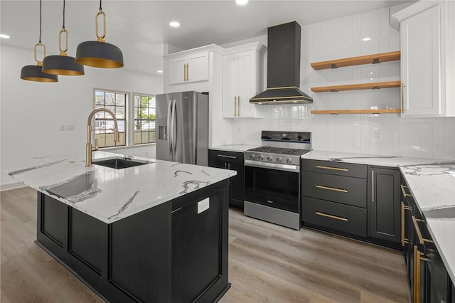 220 N C St, Rogers, AR 72756 - kitchen with appliances with stainless steel finishes, wall chimney range hood, a sink, white cabinets, and recessed lighting