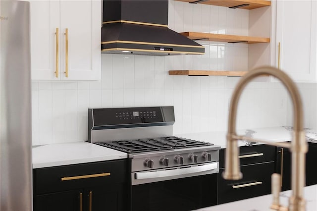 220 N C St, Rogers, AR 72756 - kitchen with custom exhaust hood, stainless steel appliances, open shelves, decorative backsplash, and light countertops