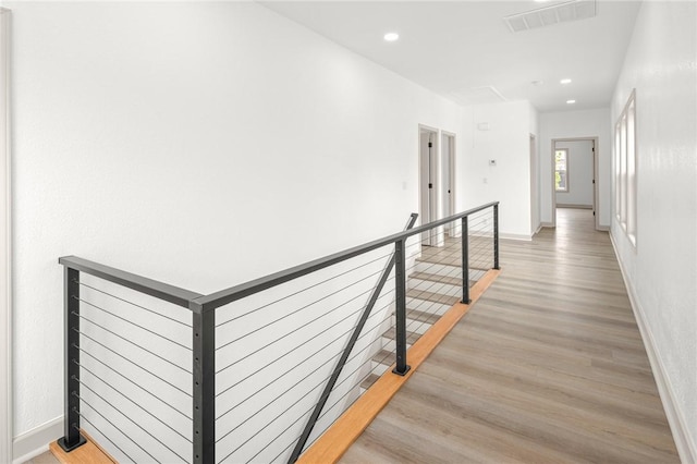 220 N C St, Rogers, AR 72756 - hallway featuring an upstairs landing, light wood finished floors, baseboards, and recessed lighting