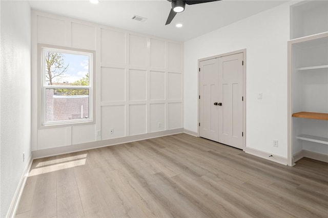 220 N C St, Rogers, AR 72756 - unfurnished bedroom featuring light wood-style floors, baseboards, ceiling fan, and recessed lighting