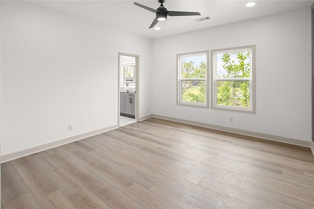 220 N C St, Rogers, AR 72756 - empty room featuring healthy amount of natural light, ceiling fan, recessed lighting, and light wood-style flooring