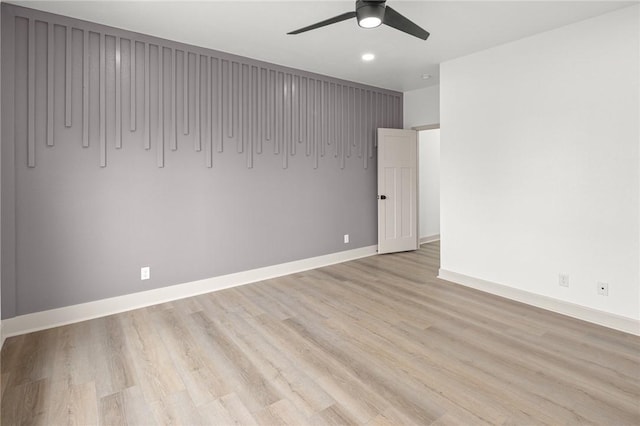 220 N C St, Rogers, AR 72756 - empty room featuring a ceiling fan, baseboards, and light wood-type flooring