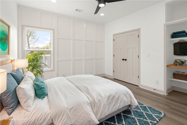 220 N C St, Rogers, AR 72756 - bedroom featuring wood finished floors, baseboards, recessed lighting, and ceiling fan