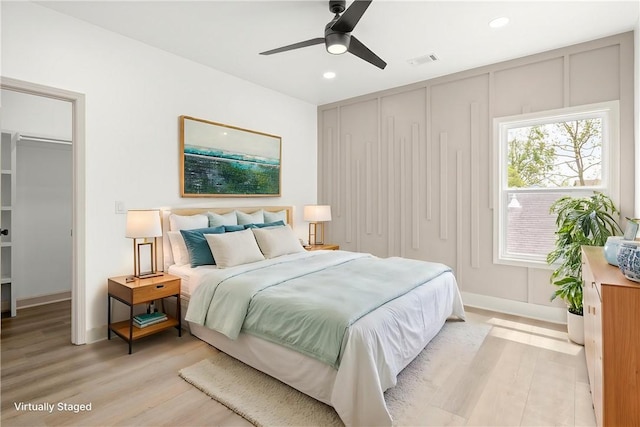 220 N C St, Rogers, AR 72756 - bedroom with light wood-style floors, a closet, recessed lighting, baseboards, and ceiling fan