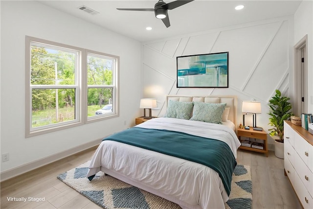 220 N C St, Rogers, AR 72756 - bedroom featuring light wood finished floors, baseboards, recessed lighting, ceiling fan, and a decorative wall