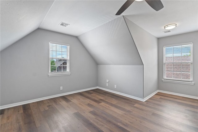 bonus room with wood finished floors, baseboards, a ceiling fan, and lofted ceiling