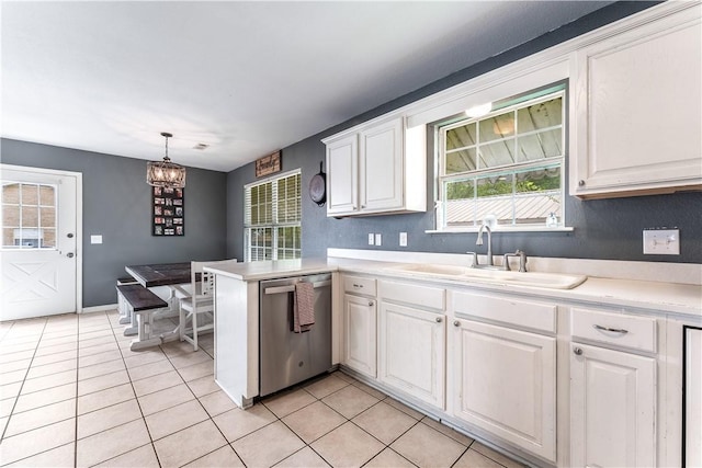 kitchen with a sink, light tile patterned flooring, dishwasher, light countertops, and white cabinets