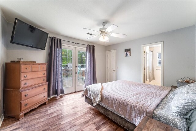 bedroom featuring wood finished floors, visible vents, a ceiling fan, french doors, and access to outside