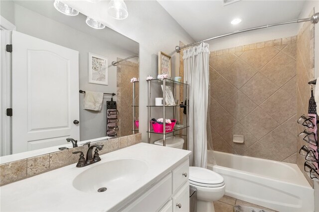 bathroom featuring toilet, recessed lighting, shower / bath combo with shower curtain, tile patterned flooring, and vanity