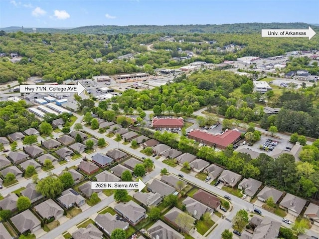 birds eye view of property with a residential view