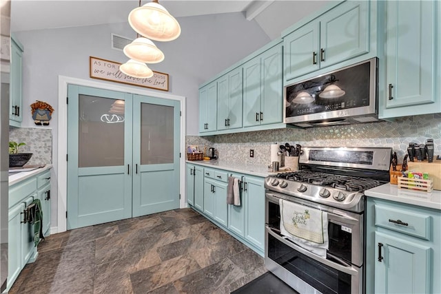 3531 Wagner Rd, Fayetteville, AR 72704 - kitchen featuring appliances with stainless steel finishes, backsplash, light countertops, decorative light fixtures, and blue cabinetry