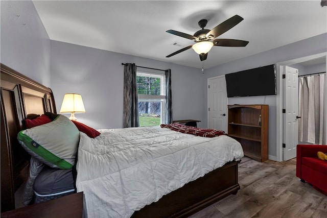 3531 Wagner Rd, Fayetteville, AR 72704 - bedroom featuring wood finished floors and ceiling fan