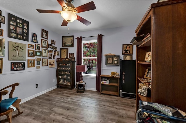 3531 Wagner Rd, Fayetteville, AR 72704 - living area featuring ceiling fan, wood finished floors, and baseboards