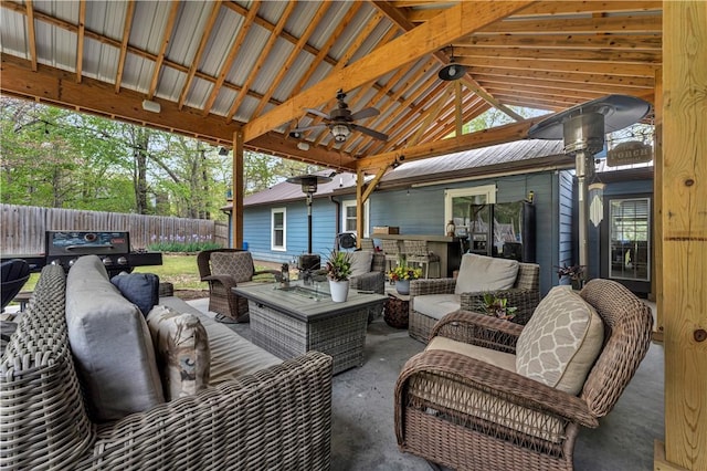 3531 Wagner Rd, Fayetteville, AR 72704 - fenced backyard featuring an outdoor living space, ceiling fan, a patio area, and a gazebo