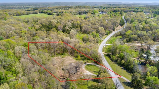 bird's eye view featuring a forest view