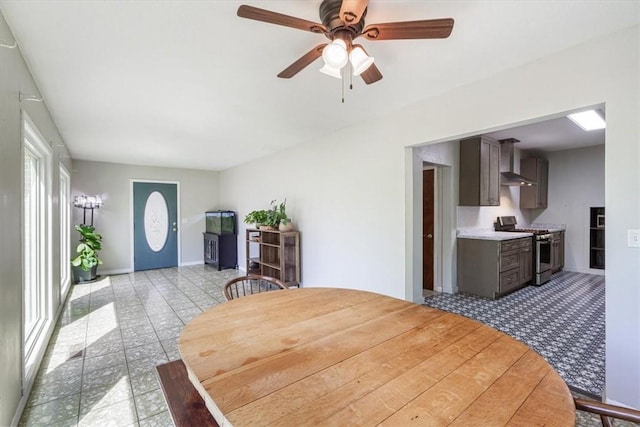 501 SE Main St, Gravette, AR 72736 - dining area with baseboards and a ceiling fan