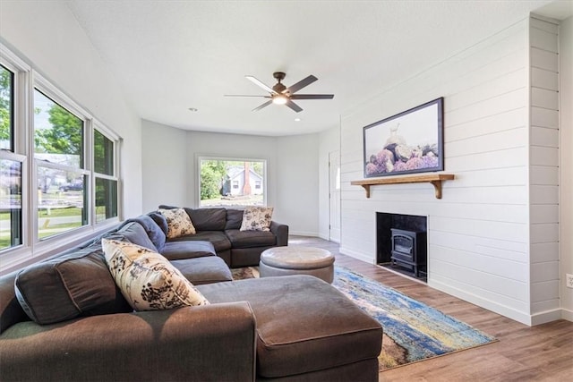 501 SE Main St, Gravette, AR 72736 - living room with wood finished floors, a ceiling fan, and baseboards