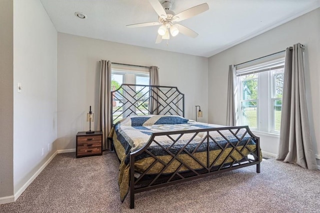 501 SE Main St, Gravette, AR 72736 - carpeted bedroom with a ceiling fan and baseboards