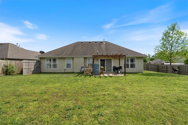 back of house featuring a pergola, a yard, a patio area, and a fenced backyard