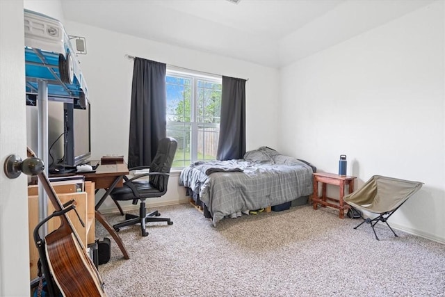 bedroom with carpet floors and baseboards