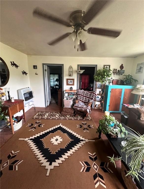 view of patio with a porch, ceiling fan, and heating unit