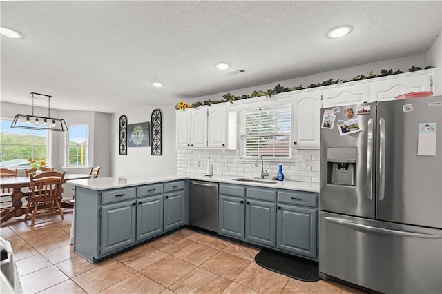 424 W Tanner Dr, Fayetteville, AR 72701 - kitchen with gray cabinetry, white cabinets, appliances with stainless steel finishes, and a sink