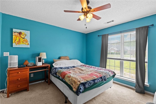 424 W Tanner Dr, Fayetteville, AR 72701 - carpeted bedroom with a textured ceiling, visible vents, ceiling fan, and baseboards