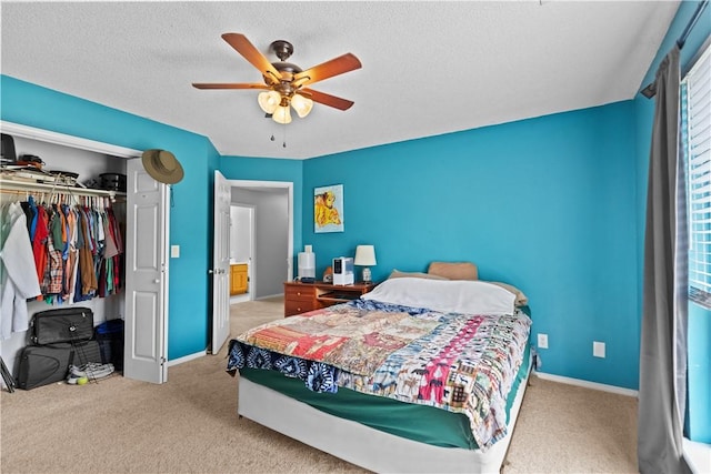 424 W Tanner Dr, Fayetteville, AR 72701 - bedroom with baseboards, a textured ceiling, a closet, and carpet