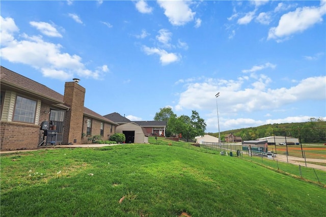 424 W Tanner Dr, Fayetteville, AR 72701 - view of yard with a garage and fence