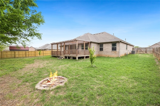 809 Sedgwick Dr, Prairie Grove, AR 72753 - rear view of property featuring an outdoor fire pit, a fenced backyard, a yard, a wooden deck, and a pergola