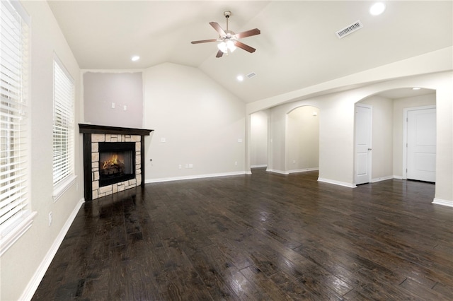 809 Sedgwick Dr, Prairie Grove, AR 72753 - unfurnished living room with a fireplace, a ceiling fan, visible vents, arched walkways, and wood finished floors
