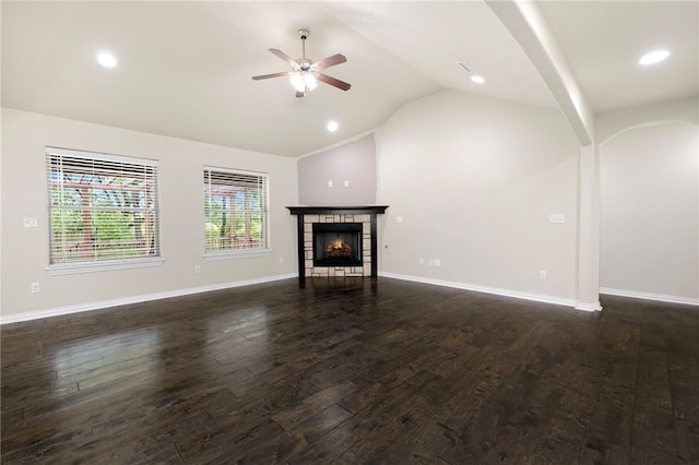 809 Sedgwick Dr, Prairie Grove, AR 72753 - unfurnished living room featuring ceiling fan, baseboards, dark wood-style flooring, a tile fireplace, and vaulted ceiling