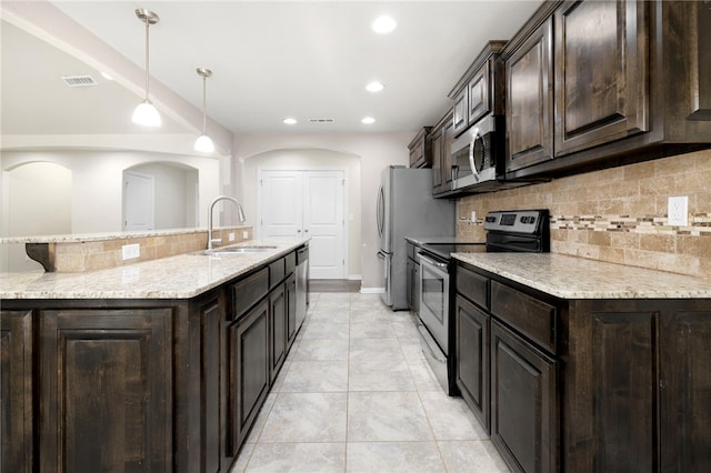 809 Sedgwick Dr, Prairie Grove, AR 72753 - kitchen with tasteful backsplash, a sink, visible vents, stainless steel appliances, and dark brown cabinetry