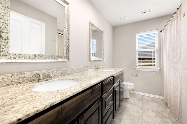 809 Sedgwick Dr, Prairie Grove, AR 72753 - bathroom featuring baseboards, visible vents, toilet, and a sink