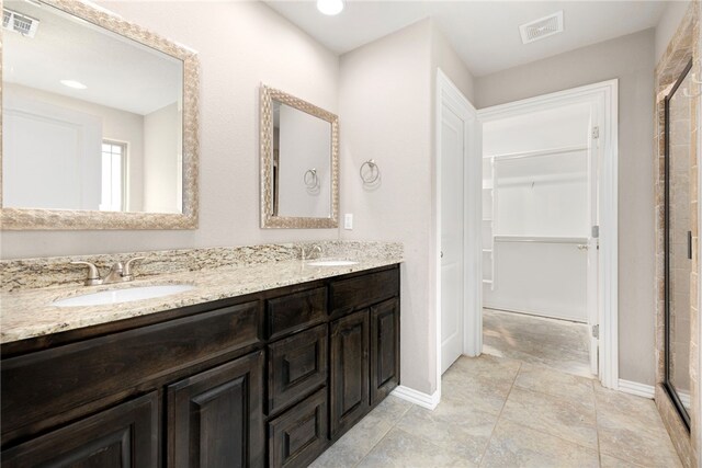 809 Sedgwick Dr, Prairie Grove, AR 72753 - bathroom with a walk in closet, a sink, and visible vents