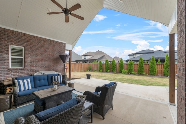view of patio / terrace featuring an outdoor living space, ceiling fan, and a fenced backyard