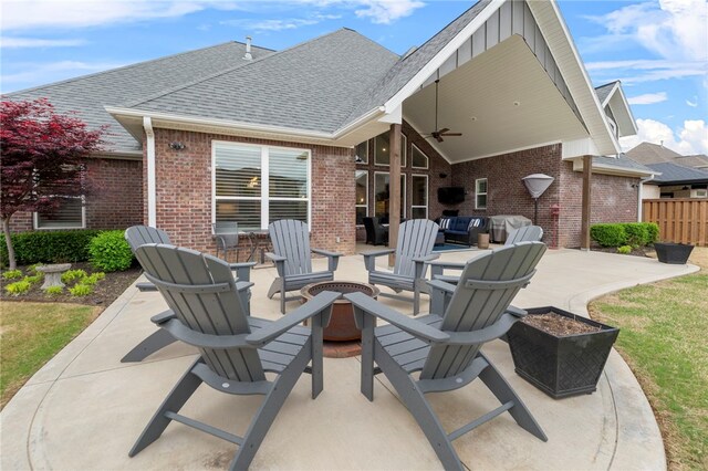 8705 Flycatcher Pl, Bentonville, AR 72713 - view of patio / terrace with a ceiling fan and an outdoor living space with a fire pit