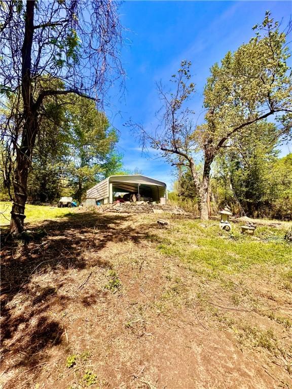 view of yard with a detached carport