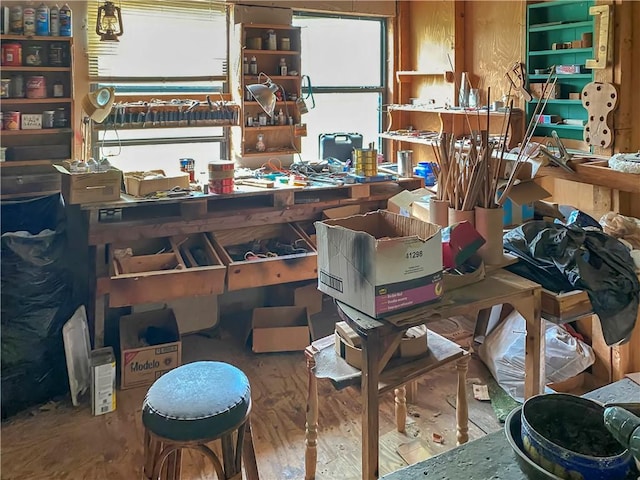 misc room featuring a workshop area and wood finished floors