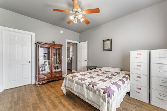 bedroom featuring a ceiling fan and wood finished floors