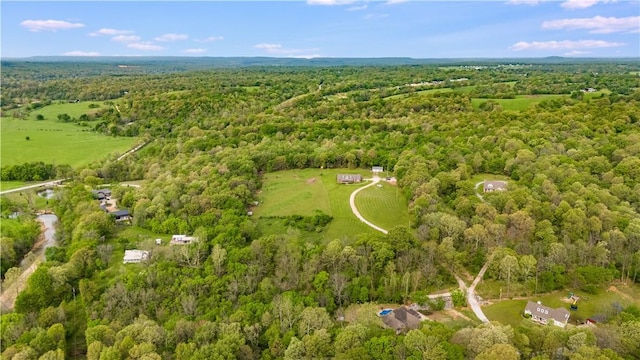 bird's eye view featuring a wooded view