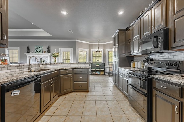 kitchen with decorative backsplash, light tile patterned floors, black appliances, dark brown cabinets, and a notable chandelier