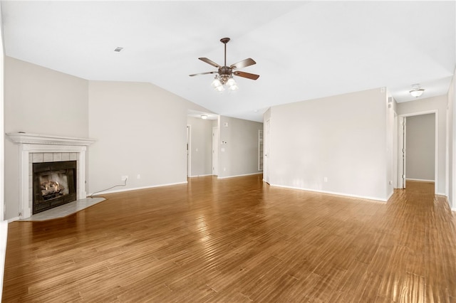 1600 N Stable Ave, Fayetteville, AR 72703 - unfurnished living room featuring ceiling fan, baseboards, light wood-type flooring, vaulted ceiling, and a fireplace