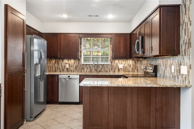 1600 N Stable Ave, Fayetteville, AR 72703 - kitchen with decorative backsplash, a sink, appliances with stainless steel finishes, visible vents, and a peninsula