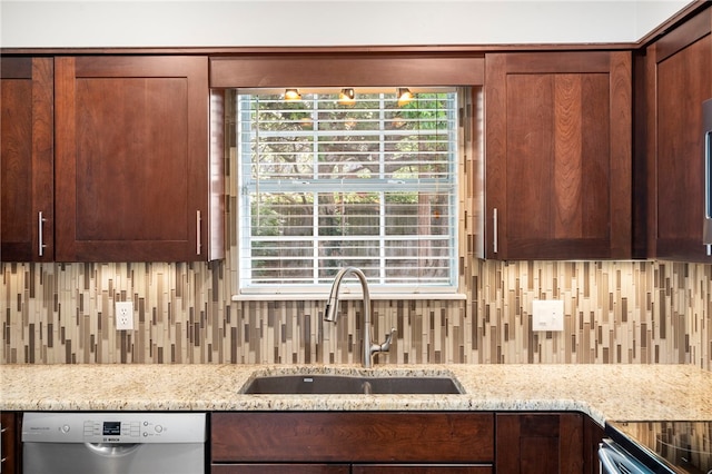 1600 N Stable Ave, Fayetteville, AR 72703 - kitchen with stainless steel dishwasher, light stone counters, backsplash, and a sink